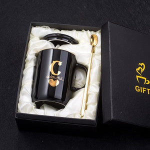 Gold and Black Ceramic Coffee/ Tea Cup With Gold Handle- Comes With A Lid And Spoon