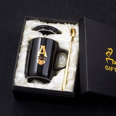 Gold and Black Ceramic Coffee/ Tea Cup With Gold Handle- Comes With A Lid And Spoon